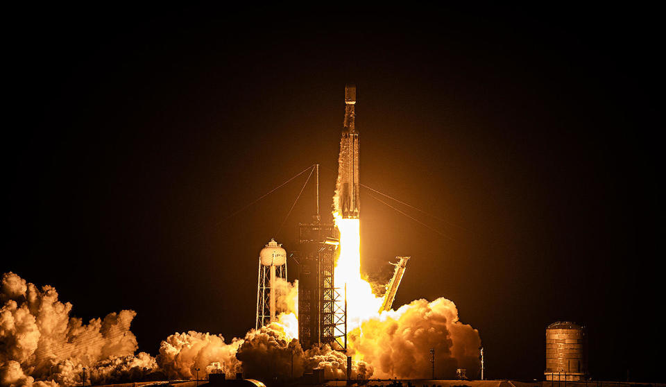 Generating more than 5 million pounds of thrust, a SpaceX Falcon Heavy rocket thunders away from launch pad 39A at the Kennedy Space Center, boosting a powerful EchoStar internet relay satellite into space. / Credit: William Harwood/CBS News