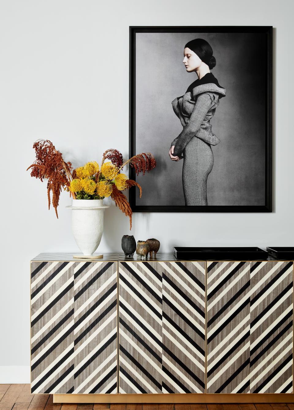 The black-and-white Rima cabinet features a graphic pattern made with technical precision. The marriage of design and craft is central to DeMuro Das's ethos—and something the brand sees reflected in its new surroundings. "It's a lot of people actually <em>making,</em> because the spaces lend themselves to that," Lee says of her Industry City neighbors. "It's a combination of people making and showing."