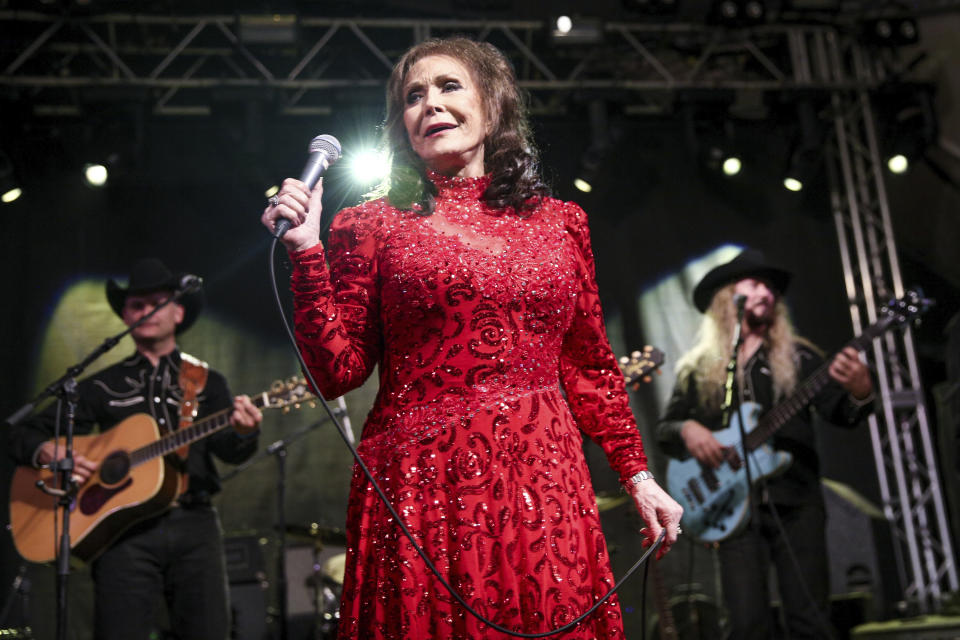 FILE - In this March 17, 2016 file photo, Loretta Lynn performs at the BBC Music Showcase at Stubb's during South By Southwest in Austin, Texas. Lynn's new book, "Me & Patsy Kickin' Up Dust: My Friendship with Patsy Cline," was released on Tuesday, April 7. (Photo by Rich Fury/Invision/AP, FIle)