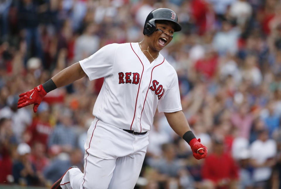 Rafael Devers is staying in Boston on a $331 million deal. (AP Photo/Michael Dwyer)