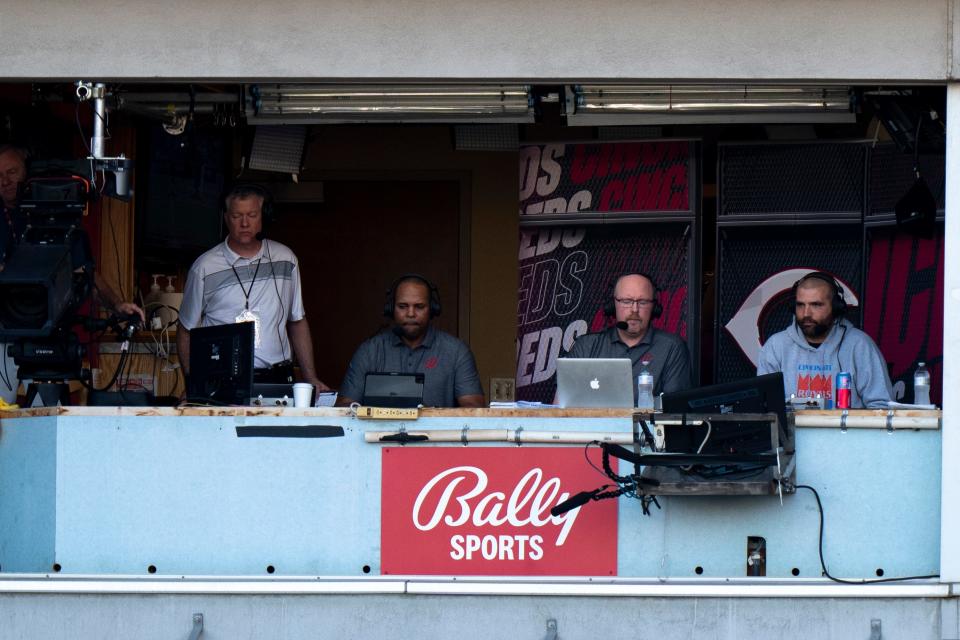 Cincinnati Reds first baseman Joey Votto participates in the live television broadcast of the Cincinnati Reds with Barry Larkin, center, and John Sadak, left, in the third inning of the MLB game between between the Cincinnati Reds and the St. Louis Cardinals at Great American Ball Park in Cincinnati, Wednesday, Aug. 31, 2022.