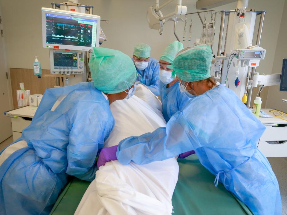 Belgium has the highest rate of the virus in Europe; nurses in one of the country’s hospitals turn a patient (EPA)