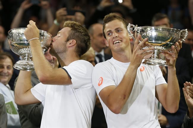 Wimbledon champions Jack Sock and Vasek Pospisil are reunited in Shanghai this weel. CANADIAN PRESS/AP/Sang Tan