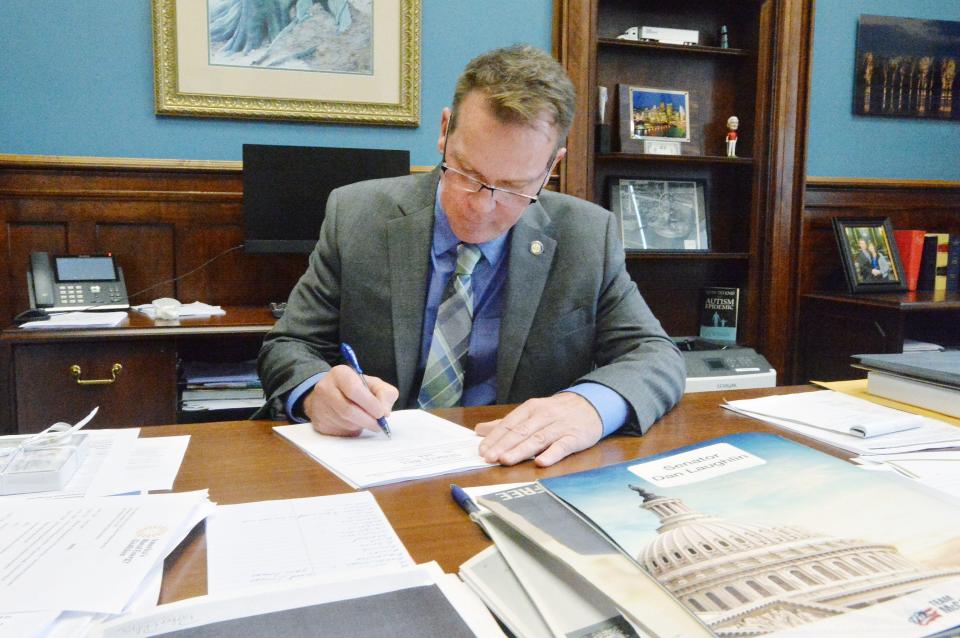 Pennsylvania state senator Dan Laughlin reads a proposed bill at his office on Nov. 4, 2021, in Erie.