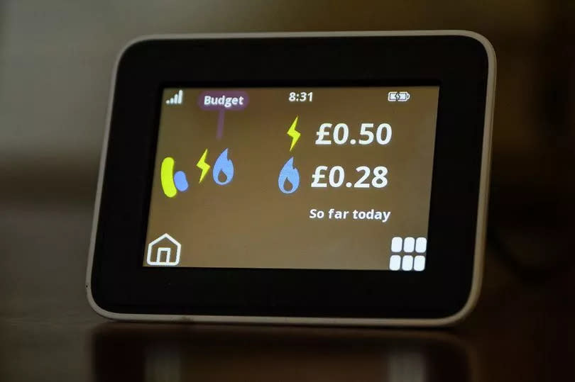 A smart meter display showing gas and electricity costs in a home