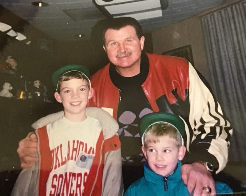 Zac Taylor (left) and Press Taylor (right) stand with Chicago Bears head coach Mike Ditka after an NFL game during the 1980s. [Provided by Taylor family]