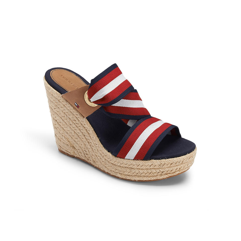 This product image released by Tommy Hilfiger shows a red, white and blue canvas slingback wedge. The rope-soled shoes have long been a staple of the fair-weather seasons, no matter if there's a chill in the air or the sidewalks are steaming. It's all good as long as the sun is shining. (AP Photo/Tommy hilfiger)