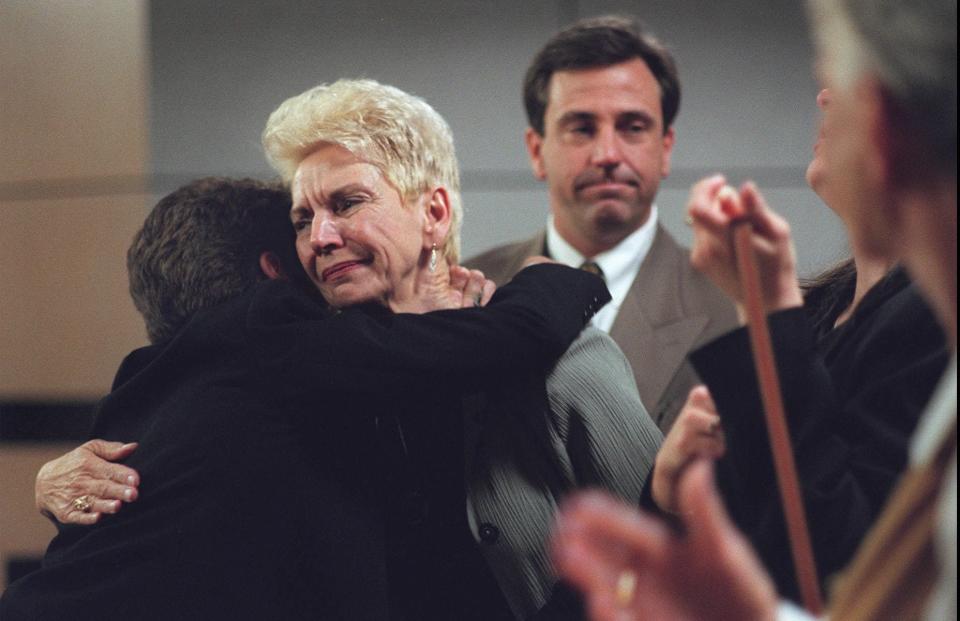 Carolyn Slattery, mother of murder victim Karen Slattery, gets a hug in 1999 from Assistant Attorney General Celia Terenzio  after Duane Owen was found guilty of  first degree murder trial. In the background is the victim's brother, Gene Slattery.