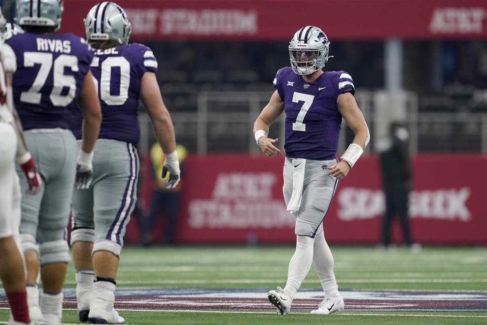 Kansas State offensive lineman Josh Rivas (76) and offensive lineman Cooper Beebe (50) celebrate with quarterback Skylar Thompson (7) after their NCAA college football game against Stanford in Arlington, Texas, Saturday, Sept. 4, 2021. (AP Photo/Tony Gutierrez)