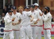 England’s Ben Stokes (C) celebrates with teammates after taking the wicket of New Zealand’s Kane Williamson for 27 on the fifth day of the first Test match against New Zealand on May 25, 2015