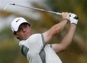 Rory McIlroy of Northern Ireland tees off on the fourth hole during the second round of the 2014 Omega Dubai Desert Classic in Dubai January 31, 2014. REUTERS/Ahmed Jadallah