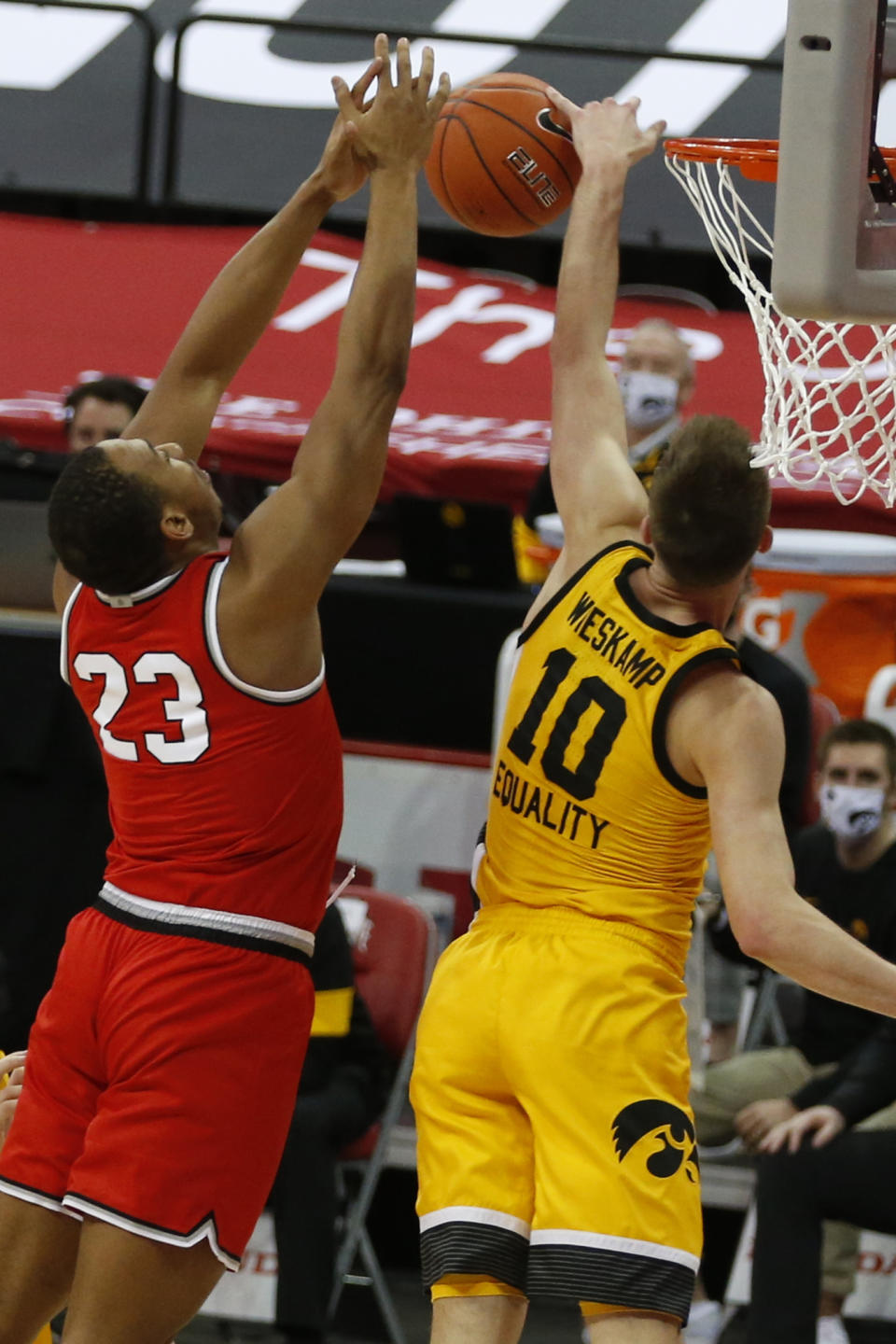 Iowa's Joe Wieskamp, right, blocks the shot of Ohio State's Zed Key during the first half of an NCAA college basketball game Sunday, Feb. 28, 2021, in Columbus, Ohio. (AP Photo/Jay LaPrete)