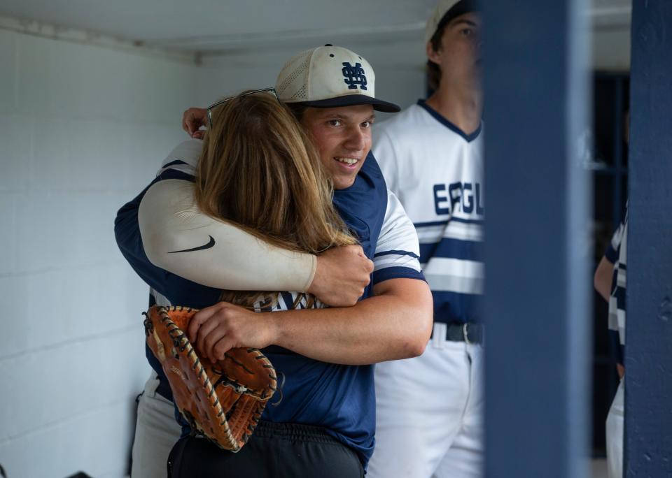 Middletown South's Joe Stanzione  (right) is hugged by Middletown South trainer Stacy White after he broke the Shore Conference single-season home run record Wednesday.