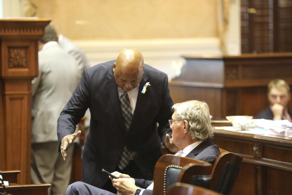 South Carolina Sen. Gerald Malloy, D-Hartsville, left, speaks to Sen. Harvey Peeler, R-Gaffney, right, during a Senate debate on Tuesday, May 3, 2022, in Columbia, S.C. (AP Photo/Jeffrey Collins)