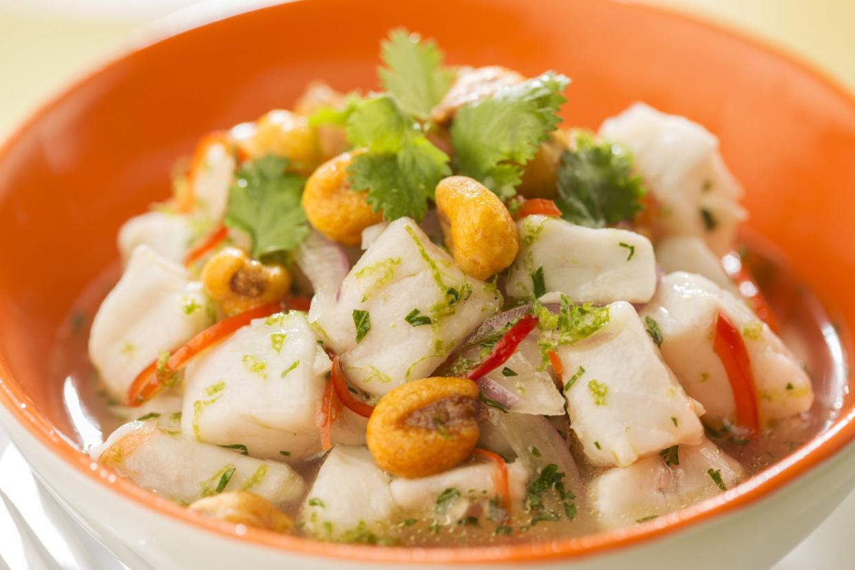 pervivan ceviche with choclo, cilantro, red onion, and leche de tigre