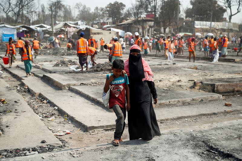 The Wider Image: 'Can't take this pain': Rohingya mother searches for son after refugee camp blaze