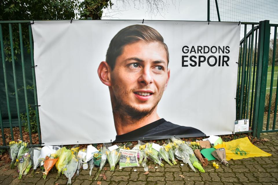 <p>Tributes have been placed under a portrait of Emiliano Sala at Nantes’ training ground (Getty Images) </p>