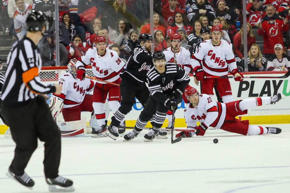 New Jersey Devils defenseman Dougie Hamilton (7) skates out of the pack against the Carolina Hurricanes during the third period at Prudential Center on Jan. 1.