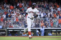 Houston Astros' Yordan Alvarez gestures toward the team's dugout while rounding the bases after hitting a two-run home run during the fourth inning of a baseball game against the Toronto Blue Jays, Saturday, May 8, 2021, in Houston. (AP Photo/Eric Christian Smith)