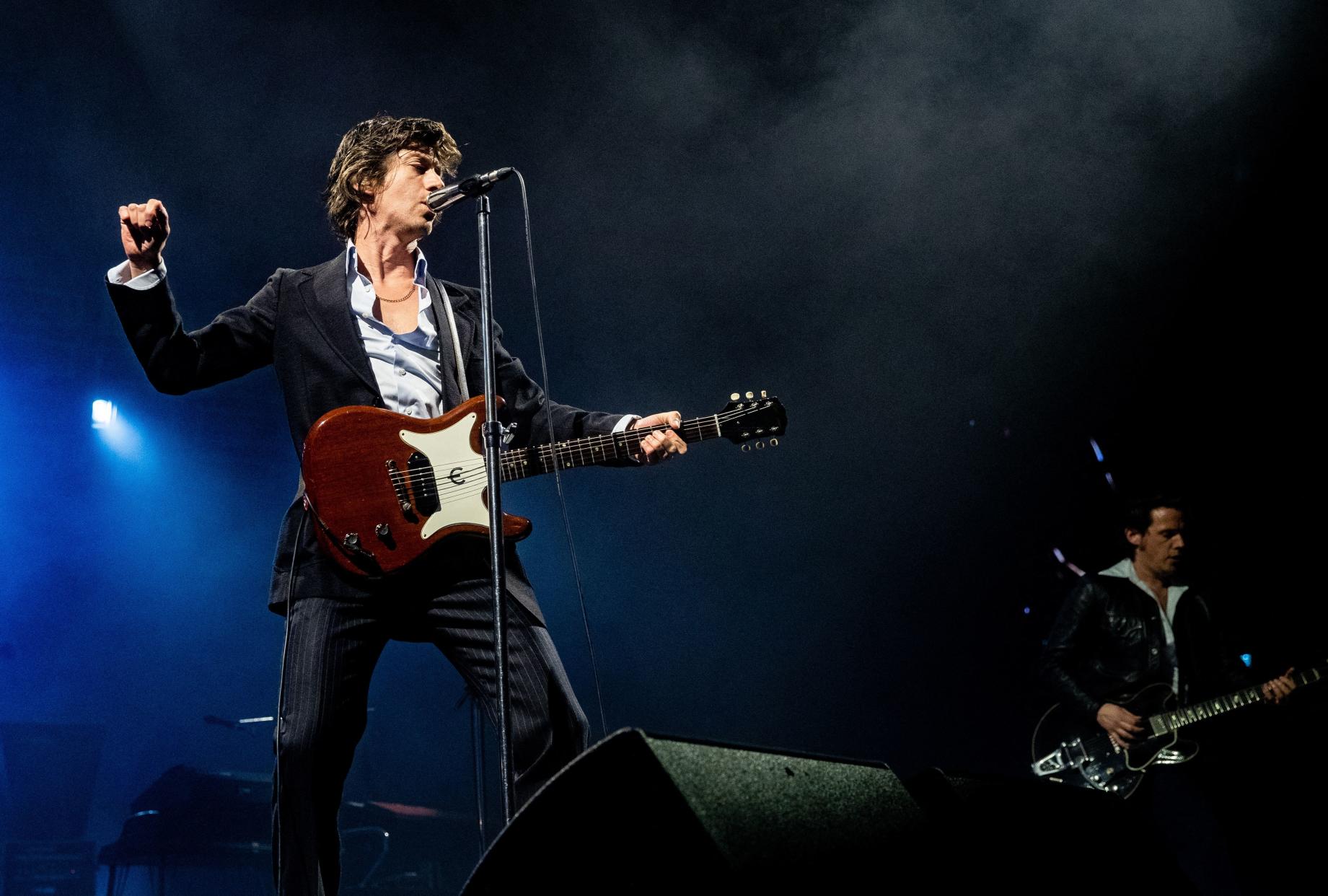 Alex Turner (L) of the Arctic Monkeys performs during a concert in the Ziggo Dome, Amsterdam, on May 5, 2023. (Photo by Paul Bergen / ANP / AFP) / Netherlands OUT (Photo by PAUL BERGEN/ANP/AFP via Getty Images)