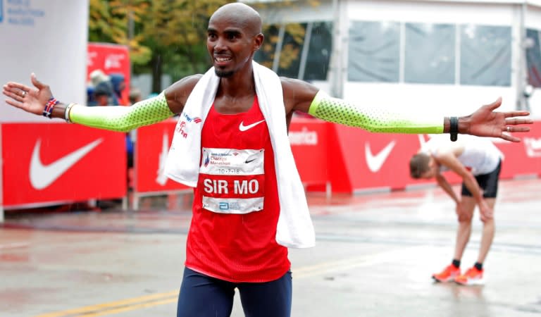 Mo Farah, who will defend his Chicago Marathon title this weekend, is facing new questions about his association with Alberto Salazar (AFP Photo/JIM YOUNG)