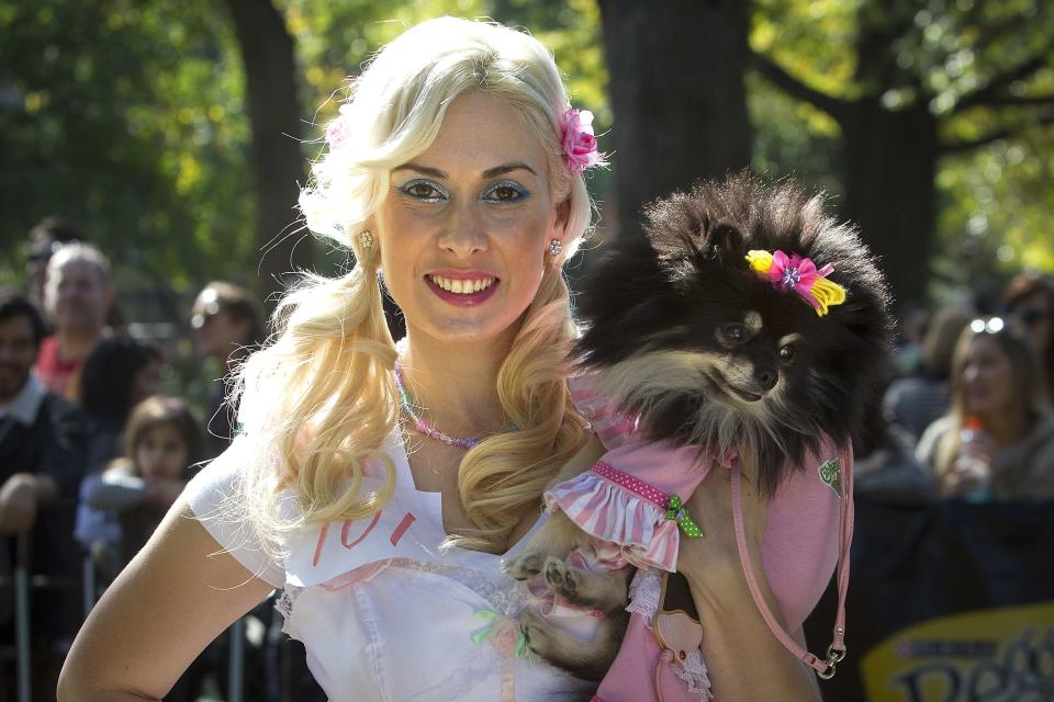 Victoria Viscardi poses for a photo with dog Gia during the 24th Annual Tompkins Square Halloween Dog Parade in New York