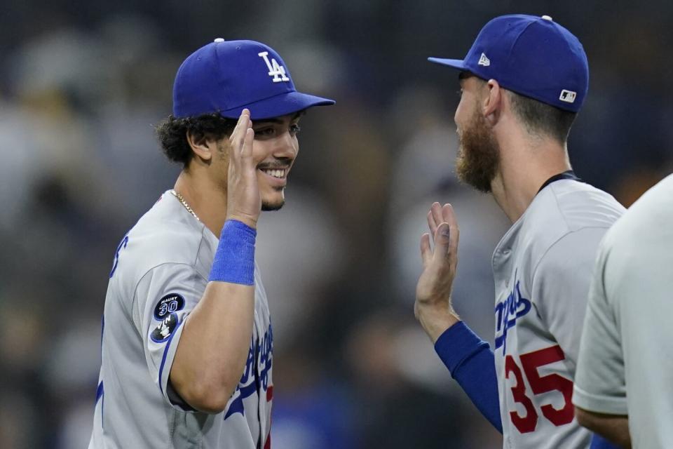 Dodgers left fielder Miguel Vargas celebrates with center fielder Cody Bellinger.