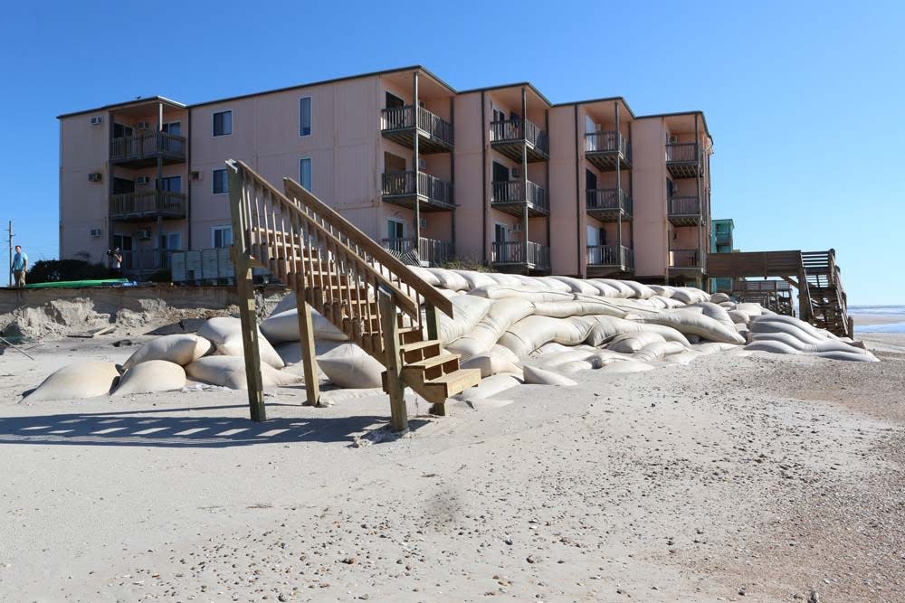 A stranded staircase and exposed sandbags are visible in North Topsail Beach after Hurricane Florence slammed into the region back in September 2018.