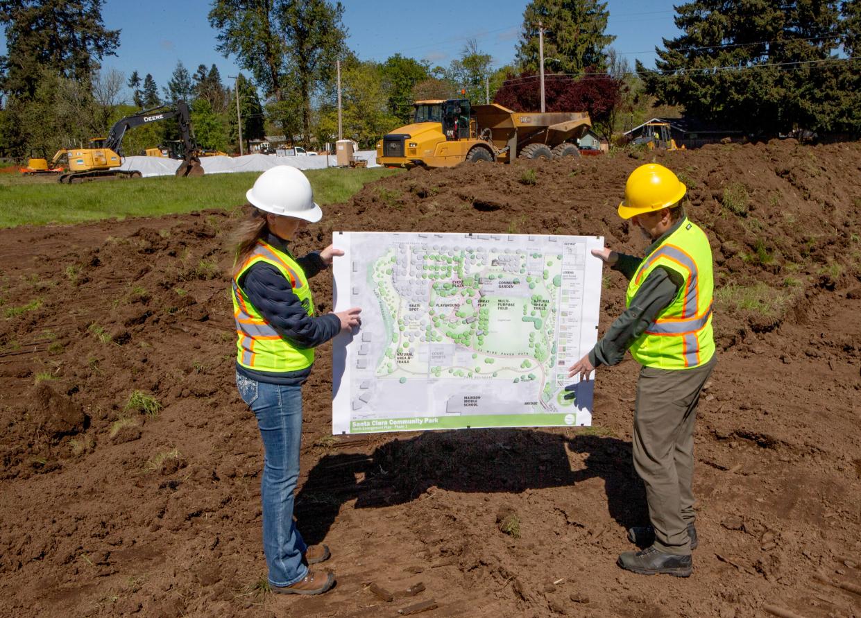 Eugene Public Works Engineering Landscape Architect Marina Wrensch and Parks and Open Space Landscape Architect Mark Kosmos visit the site of the Santa Clara Community Park as construction of the new park on River Loop 2 begins.