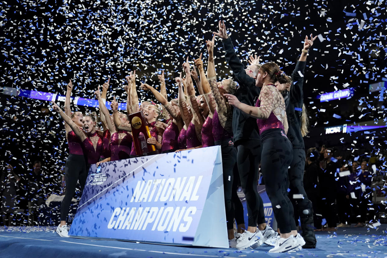 Oklahoma celebrates after winning the NCAA women's gymnastics team title, Saturday, April 15, 2023, in Fort Worth, Texas. (AP Photo/Tony Gutierrez)