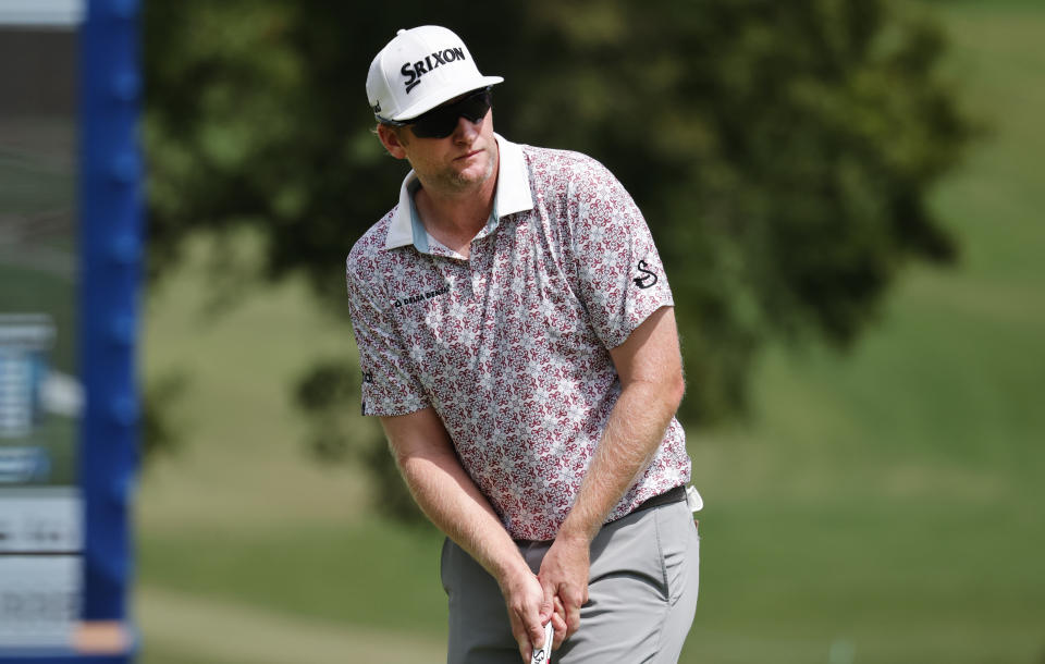 FILE - Ryan Brehm watches his putt on the 18th green during the second round of the Wyndham Championship golf tournament, Friday, Aug. 5, 2022, in Greensboro, N.C. Brehm grew up in Mount Pleasant, Michigan, where as a boy he used to watch LPGA player Kelly Robbins hit shots on the range. (AP Photo/Reinhold Matay, File)