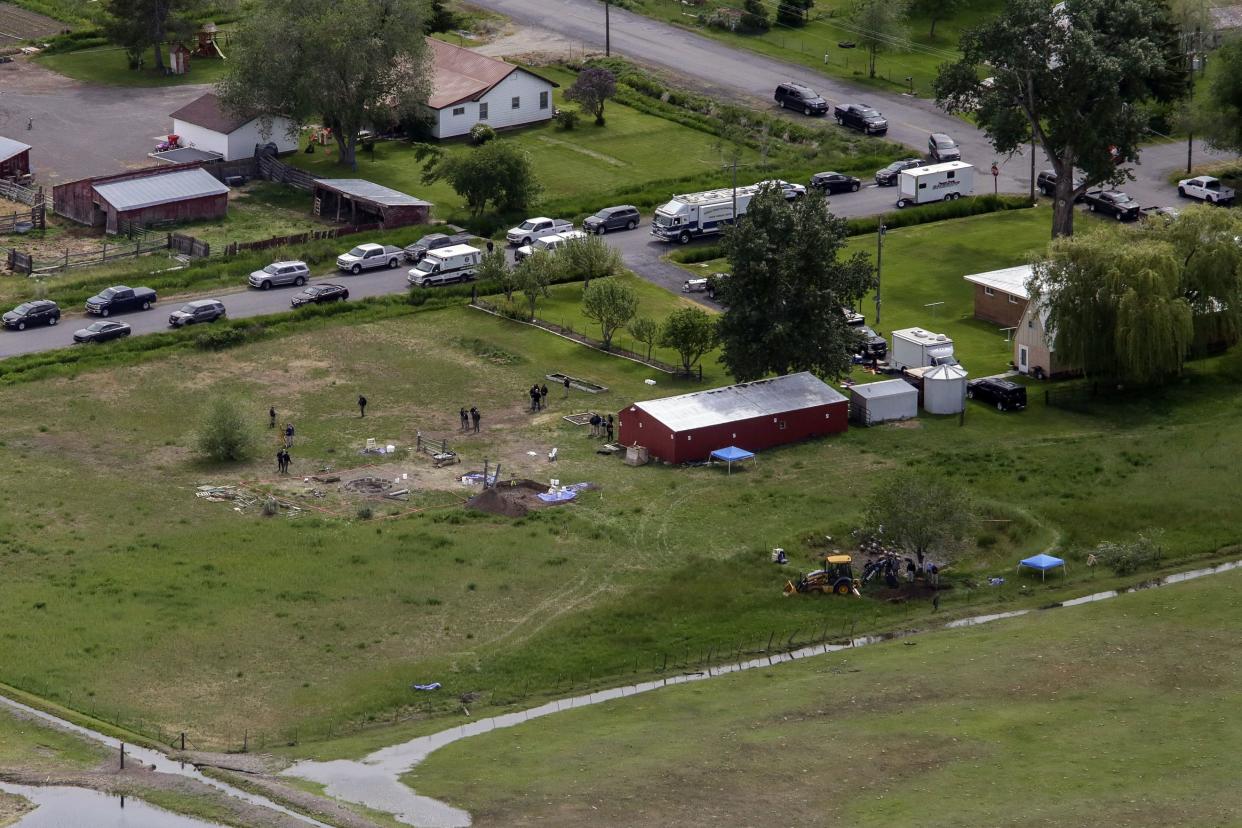 In this aerial photo, investigators search for human remains at Chad Daybell's residence on Tuesday, June 9, 2020, in Salem, Idaho. Authorities say they uncovered human remains at Daybell's home as they investigated the disappearance of his new wife’s two children.