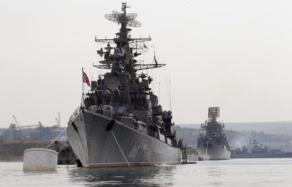 Two Russian warships anchored at a naval base in the Ukrainian Black Sea port of Sevastopol.