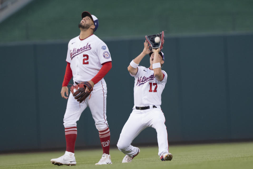 Washington Nationals left fielder Alex Call (17) catches a fly ball by San Diego Padres' Matt Carpenter during the fourth inning of a baseball game in Washington, Wednesday, May 24, 2023. At left is second baseman Luis Garcia. (AP Photo/Manuel Balce Ceneta)