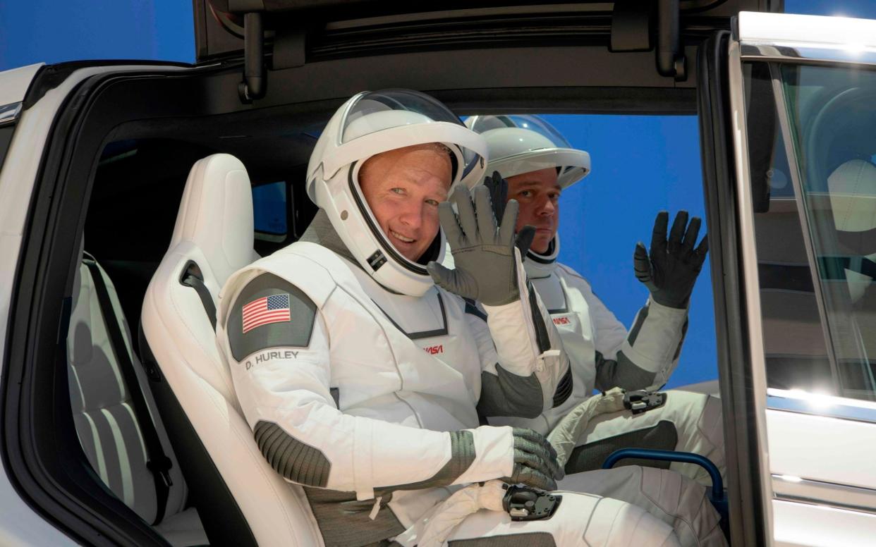Astronauts Douglas Hurley, left, and Robert Behnken - AFP