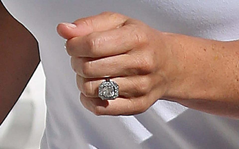 Pippa Middleton shows off her art-deco style engagement ring. - Credit: PA