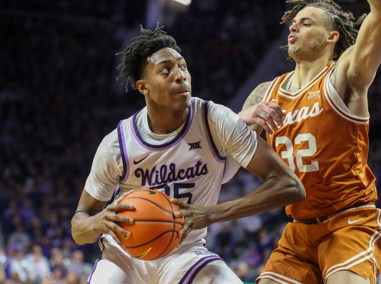 Kansas State forward Nae'Qwan Tomlin (35) looks for a shot against Texas' Christian Bishop (32) during Saturday's game at Bramlage Coliseum.