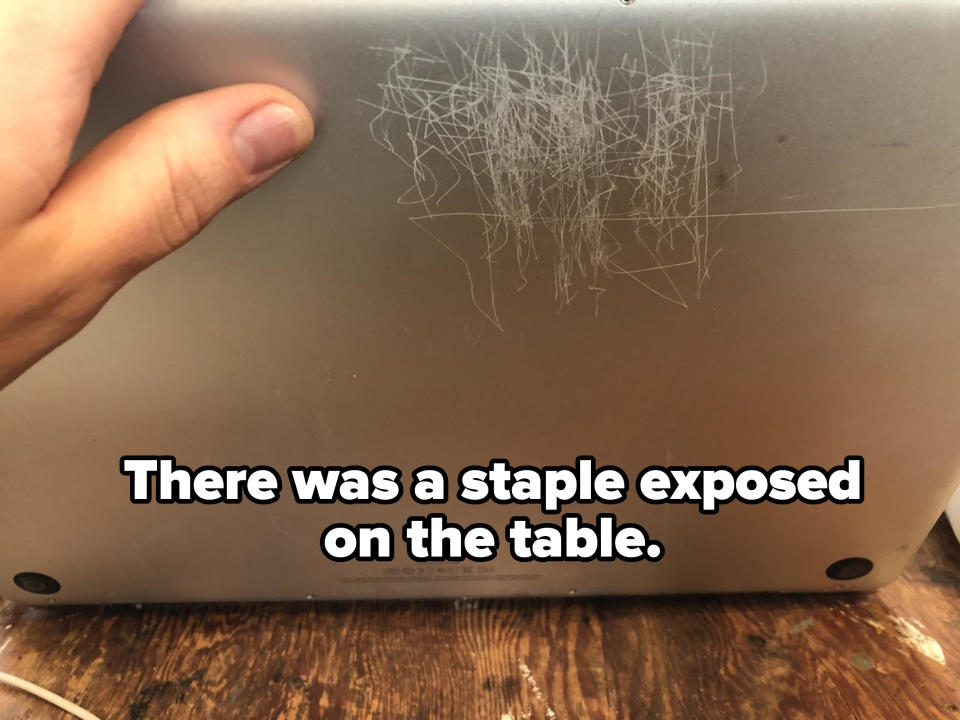 staple marks on the back of a laptop