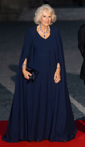 <p>Samir Hussein/WireImage</p> Queen Camilla wearing Dior at a state banquet at the Palace of Versailles on Sept. 20, 2023.