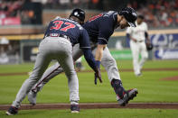 Atlanta Braves' Adam Duvall celebrates his two-run home run with third base coach Ron Washington during the third inning of Game 1 in baseball's World Series between the Houston Astros and the Atlanta Braves Tuesday, Oct. 26, 2021, in Houston. (AP Photo/Ashley Landis)