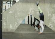 Amal Mourad, parkour trainer, performs a handstand in scene shot for the Nike Middle East ad campaign filmed in Dubai, UAE, in this undated handout photo. Nike/Handout via REUTERS