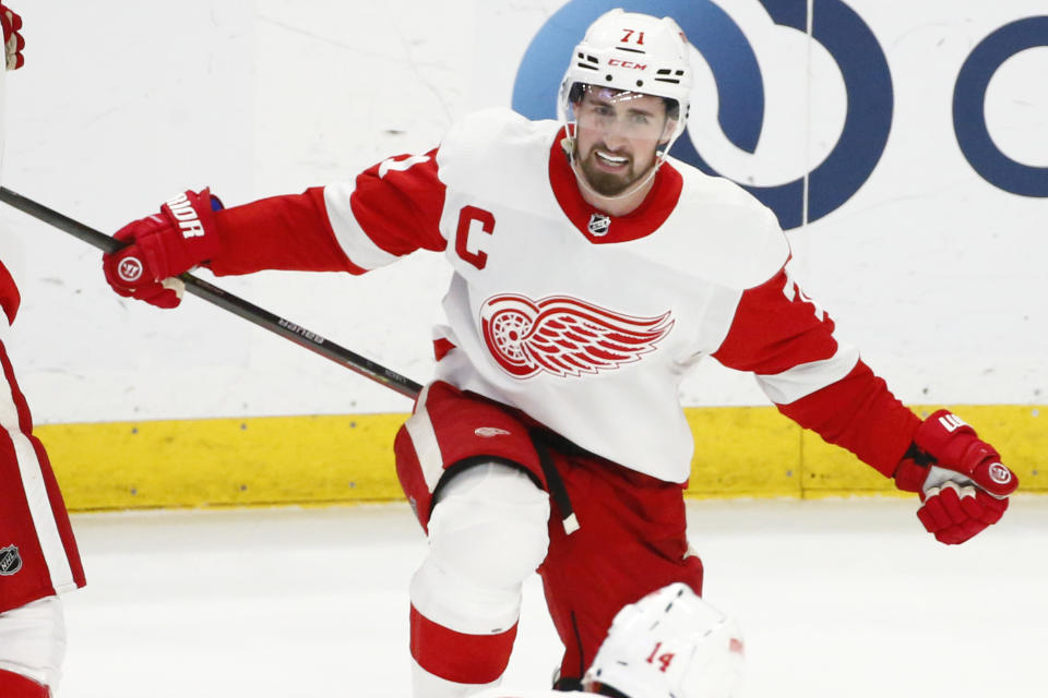 Detroit Red Wings center Dylan Larkin (71) celebrates his goal during the overtime period of an NHL hockey game against the Buffalo Sabres, Monday, Jan. 17, 2022, in Buffalo, N.Y. (AP Photo/Jeffrey T. Barnes)