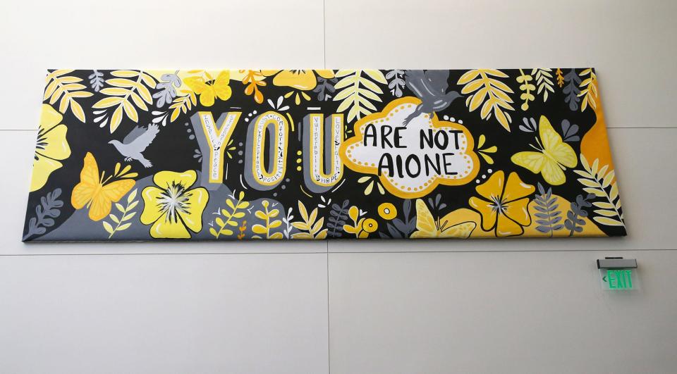 Students at Dover High School created an inspirational supportive banner related to mental health which greets people when they enter the school.