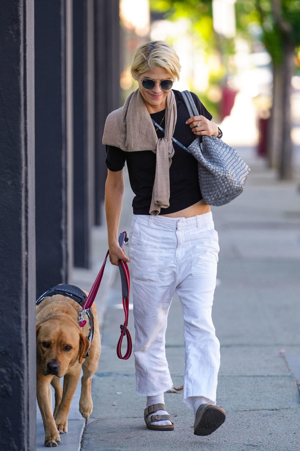 selma and her dog walking outside