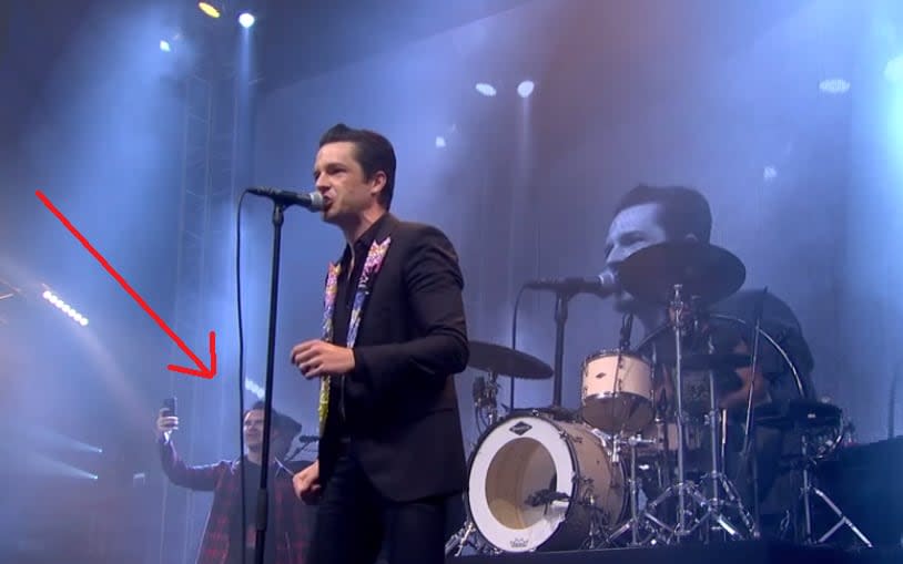 Jimmy Carr (left) popped up during The Killers' secret set - Credit: BBC