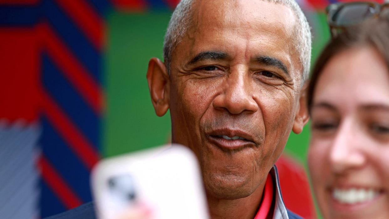 Obama poses for a selfie at a Virginia game