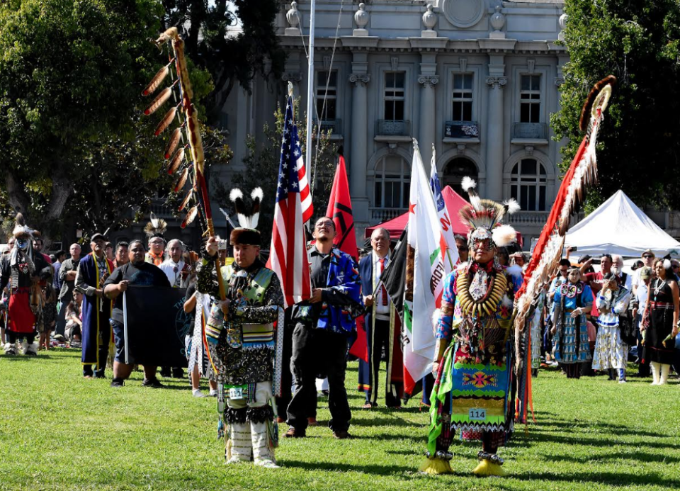 <em>2019 Indigenous Peoples' Day Powwow grand entry in Berkeley, Calif. (Photo/Christopher Burquez for Native News Online)</em>