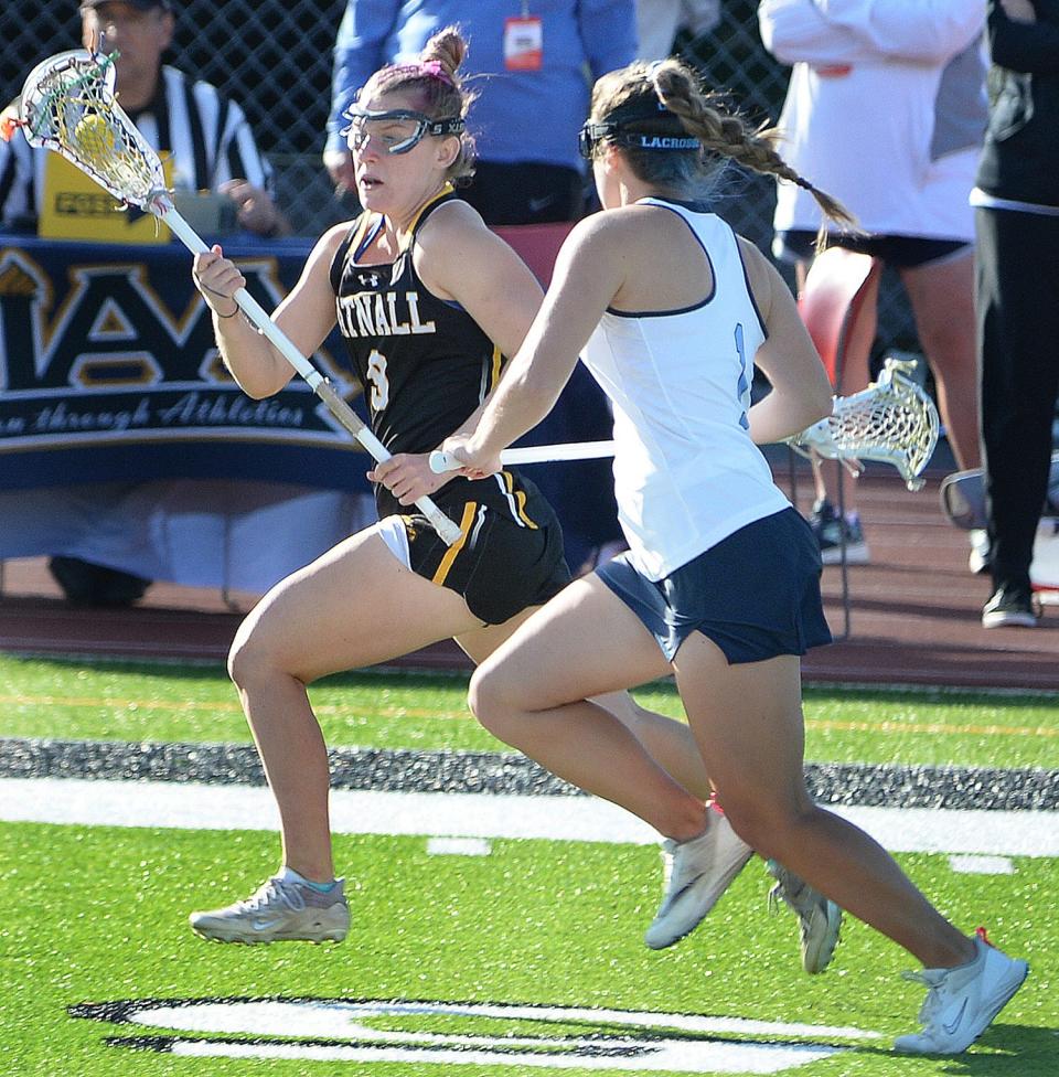 Charlotte Wilkinson of Tatnall races along the sideline with Montana Jones of Cape Henlopen close behind.