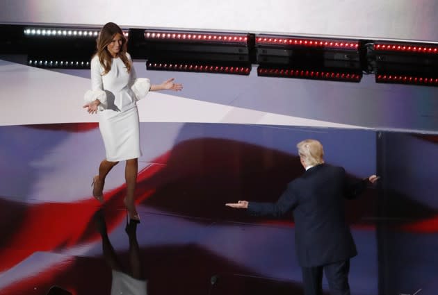 Donald Trump welcoming Melania onto the stage this evening. (Aaron Bernstein / Reuters)