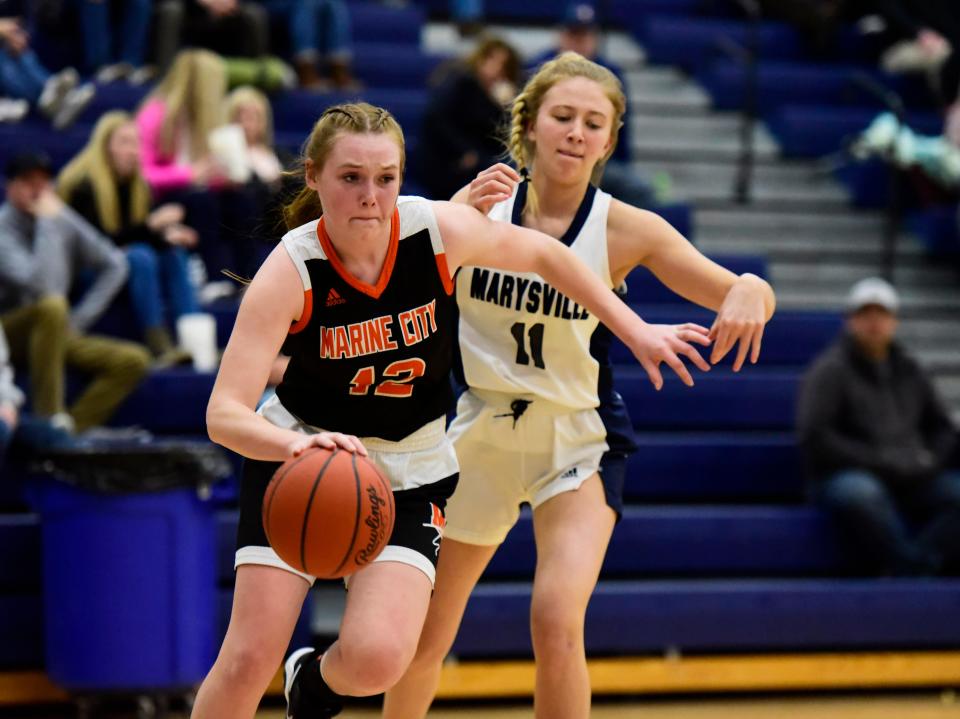 Marine City's Josalyn Dietlin drives to the basket during a game last season. She scored 11 points in the Mariners' 58-7 win over Clawson on Friday.